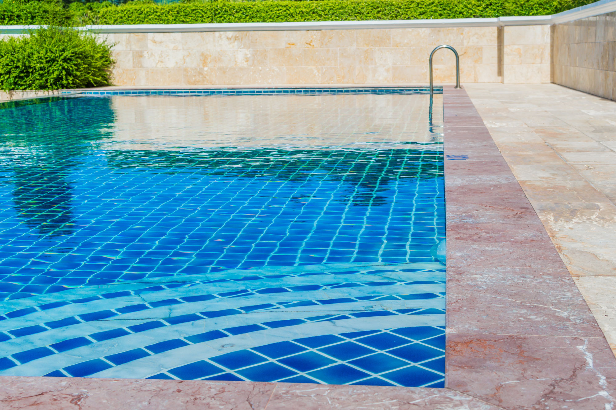 Stone patio and pool deck landscaping project in Ottawa